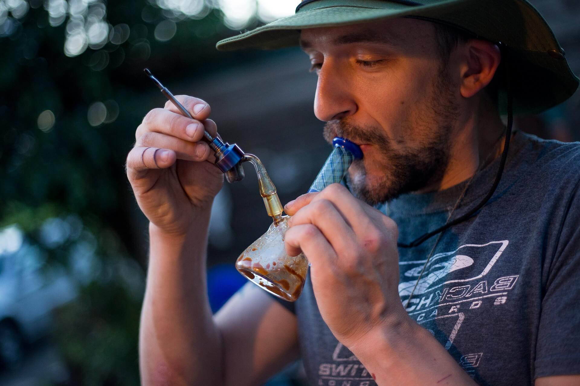 Man dabbing marijuana